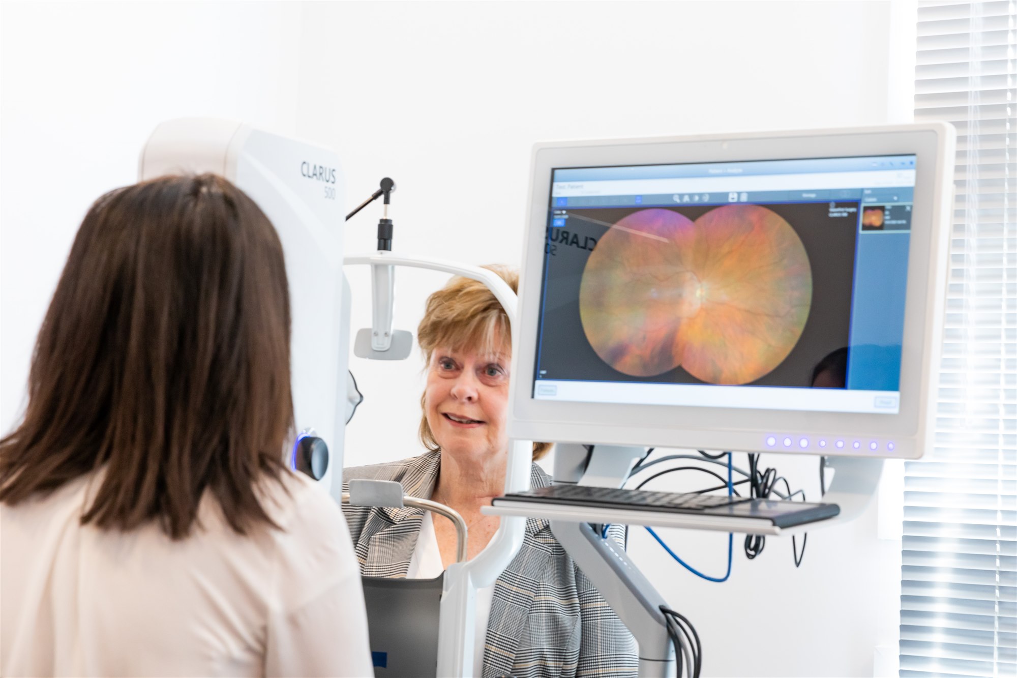 Patient using retinal diagnostic equipment at Southland Eye Surgeons